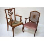 CHIPPENDALE STYLE ELM ARMCHAIR with a shaped top rail above a central carved pierced splat with a
