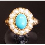 TURQUOISE AND SEED PEARL CLUSTER RING the central oval cabochon turquoise stone in twelve pearl