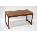 TEAK OCCASIONAL TABLE with an oblong top, standing on shaped end supports, 82cm wide