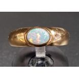 OPAL SINGLE STONE DRESS RING the bezel set opal on nine carat gold shank, ring size L-M