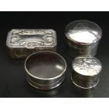 FOUR VICTORIAN AND LATER SILVER PILL BOXES comprising a rectangular Victorian example with canted