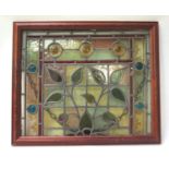 EARLY 20TH CENTURY LEADED GLASS WINDOW with stylised flowers, framed, 39cm x 48cm