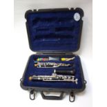 SELMER OBOE in a hard shell fitted case, in three sections with a seperate small box with three