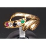 ATTRACTIVE SAPPHIRE, EMERALD, RUBY AND CZ DRESS RING the multi gemstones in decorative scroll