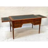 CHERRY WOOD DESK the inset moulded top with gilt decoration with two pull out side slides with inset