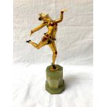 ART DECO STYLE SPELTER FIGURE of a female prancing jester with ivorine face and hands, on a
