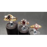 THREE DIAMOND AND GEM SET SILVER GILT RINGS comprising a sapphire and diamond three stone ring of