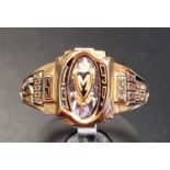 TEN CARAT GOLD COLLEGE RING BY JOSTENS the central M in heart shaped cartouche, flanked by relief