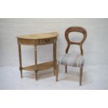 DISTRESSED WALNUT BALLOON BACK CHAIR with a stuffover seat, standing on tapering front supports,