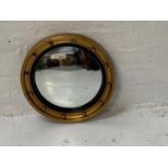 CIRCULAR GILT FRAMED CONVEX WALL MIRROR with applied ball decoration, 39cm diameter