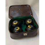 SET OF INKERMAN LAWN BOWLS marked 5", contained in bowling carry case