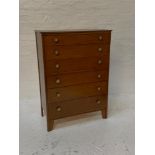 OAK UTILITARIAN CHEST with a rectangular top above six graduated drawers with pierced gilt metal