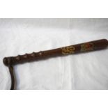 GEORGIAN POLICE TRUNCHEON with painted crown and cipher, ribbed handle and leather tassel, 38cm long