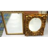 GILT FRAMED WALL MIRROR OF ROCOCO DESIGN with oval mirror centre, 57cm x 47cm; together with a