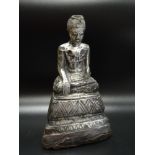 SILVER OVERLAID BURMESE BUDDHA STATUE late 19th/early 20th century, the seated figure raised on