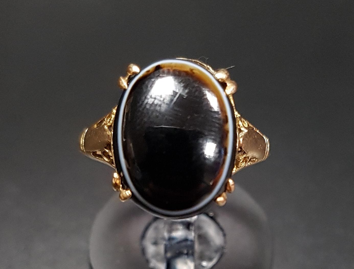 AGATE SET DRESS RING the oval cabochon banded agate on nine carat gold shank, ring size J