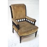 VICTORIAN ARMCHAIR the ebonised frame with gilt detail, button back and seat with railed padded