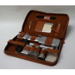 HAZEL PIG LEATHER GENTLEMAN'S VANITY SET with a fitted interior including chrome boxes, comb,