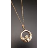 NINE CARAT GOLD CLADDAGH PENDANT on nine carat gold chain, total weight approximately 7.3 grams