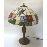 TIFFANY STYLE TABLE LAMP with a dome shaped leaded shade decorated with dragonflies, 59cm high