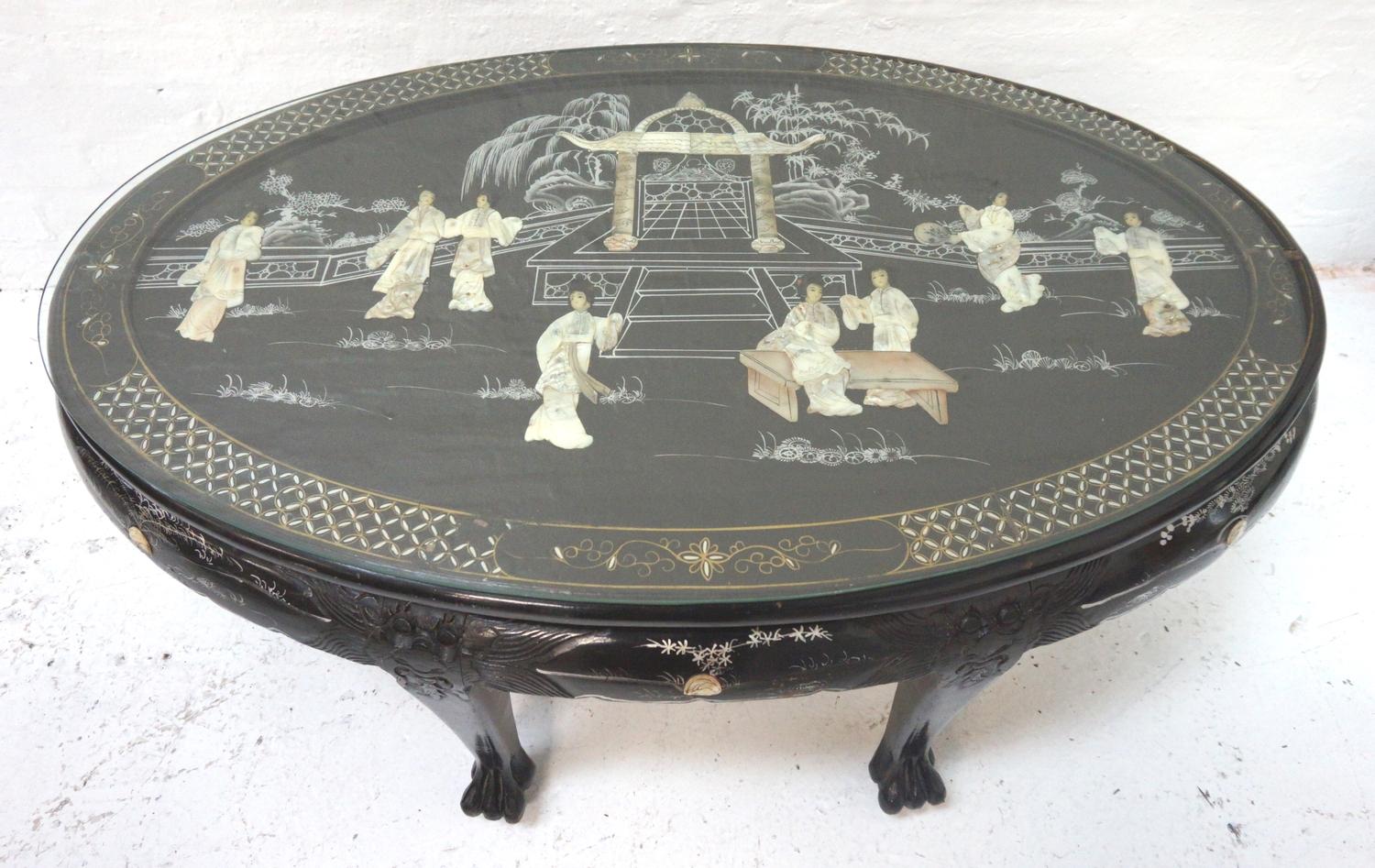 CHINESE EXPORT WARE EBONISED OCCASIONAL TABLE with an oval top decorated with mother of pearl