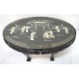CHINESE EXPORT WARE EBONISED OCCASIONAL TABLE with an oval top decorated with mother of pearl