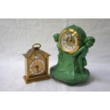 ART DECO STYLE METAL MANTLE CLOCK with two cherubs either side of face and landscape scenes;