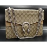 GUCCI DIONYSUS MEDIUM GG SHOULDER BAG in Beige GG Supreme canvas with textured tiger head closure,