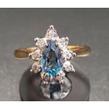BLUE TOPAZ AND DIAMOND CLUSTER RING the pear cut blue topaz approximately 0.75cts in nine diamond