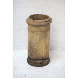 A TERRACOTTA CHIMNEY POT of cylindrical forum, 62cm high