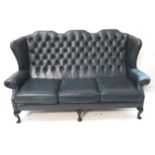 CHESTERFIELD THREE SEAT QUEEN ANNE STYLE SOFA with a high wing back above scroll arms, in blue