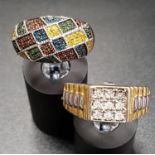 TWO MULTI DIAMOND SET RINGS one bombe style ring with pave set multi coloured diamonds, the other