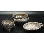 VICTORIAN CIRCULAR SILVER SALT with shaped rim and floral and scroll decoration to the body,