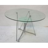 MODERN GLASS DINING TABLE the circular glass top supported by polished steel angled supports with