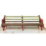 VICTORIAN CAST IRON BENCH the three shaped supports with floral swag decoration, with the two end