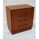 G PLAN TEAK CHEST OF DRAWERS with a moulded top above four graduated drawers, standing on a plinth