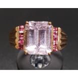 KUNZITE AND PINK GEM SET DRESS RING the central emerald cut kunzite with a vertical row of pink