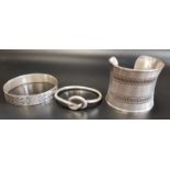 LARGE SILVER CUFF BANGLE with rope twist detail; together with two further silver bangles, one