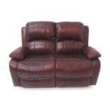 FAUX LEATHER TWO SEAT SOFA in claret with manually operated reclining seats, 145cm wide