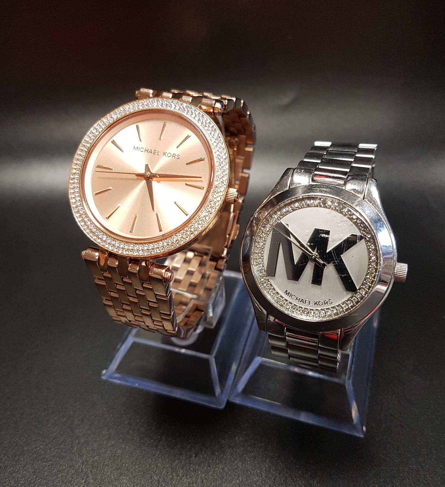 TWO MICHAEL KORS WRISTWATCHES one in rose gold tone, model number MK-3715; the other in silver tone,
