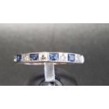 SAPPHIRE AND DIAMOND HALF ETERNITY RING with alternating sapphires and diamonds, on unmarked white