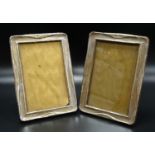PAIR OF GEORGE V SILVER PHOTOGRAPH FRAMES of rectangular form with raised detail, Birmingham 1918,