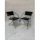 SET OF FOUR CHROME FRAME DINING CHAIRS with rectangular padded backs above square padded seats, on