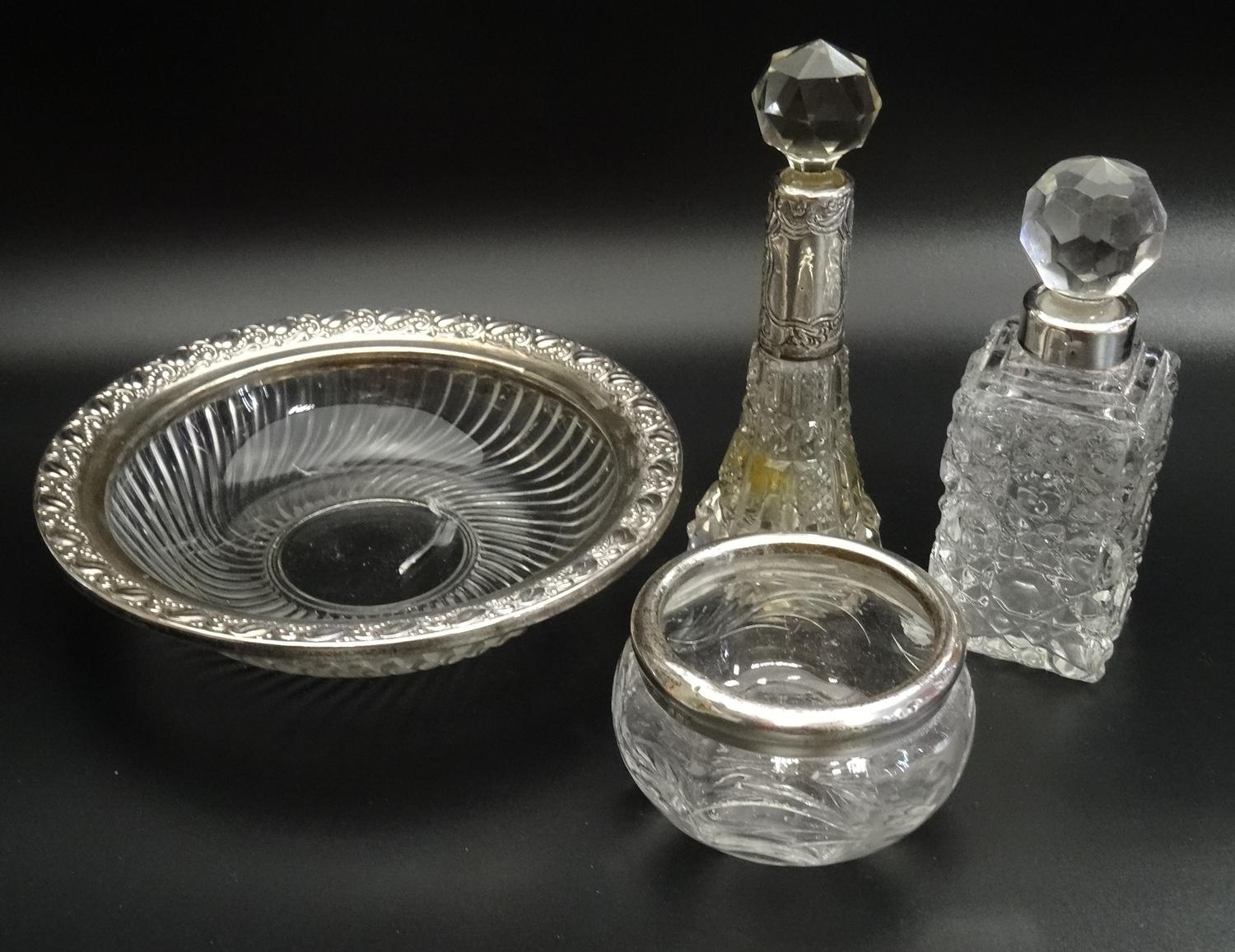 FOUR SILVER MOUNTED CUT GLASS DRESSING TABLE ITEMS comprising two circular dishes and two silver