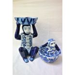VICTORIA PARK POTTERY a seated blue and white monkey with a bowl on its head, 37.5cm high; and a