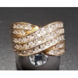 MULTI DIAMOND DRESS RING the five channel set rows of diamonds in crossover setting, the diamonds