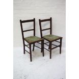 PAIR OF EDWARDIAN MAHOGANY BEDROOM CHAIRS with floral covered seats, standing on tapering supports
