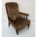 VICTORIAN ARMCHAIR with a mahogany frame and a button back above padded arms with turned supports
