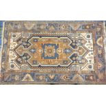 TURKOMAN RUG in brown, blue, coral and cream, with geometric motif decoration, 179cm x 109cm