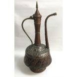 LARGE MIDDLE EASTERN COPPER COFFEE POT with a decorative hammered body, elongated neck, spout and